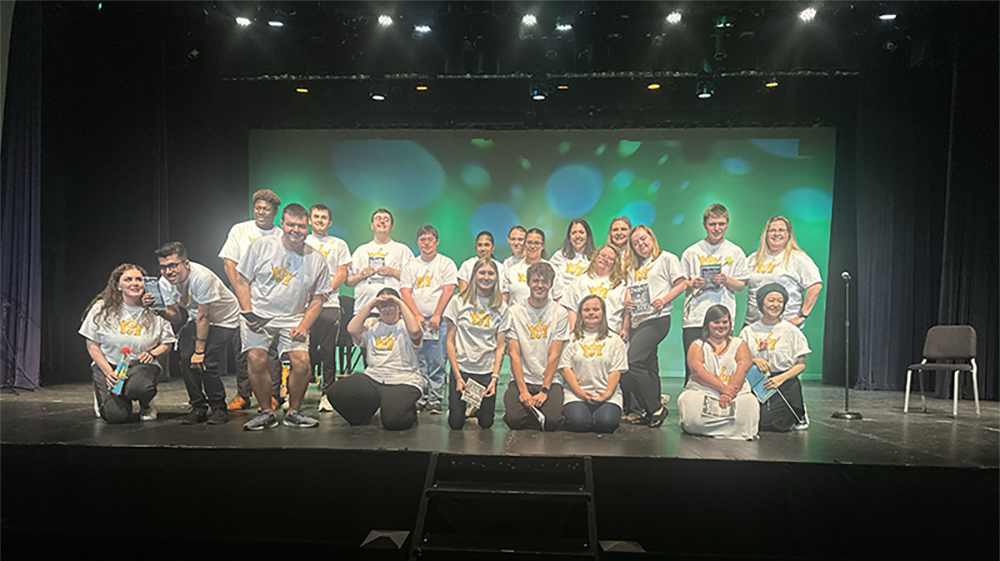 group of soar and strive students on a stage
